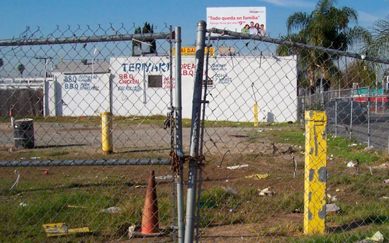 Environmental professional observing site conditions during a Phase I ESA.